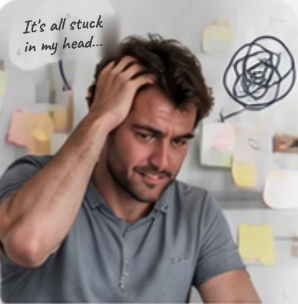 A stressed man, hand in his hair, surrounded by scattered sticky notes: “It's all stuck in my head…”
